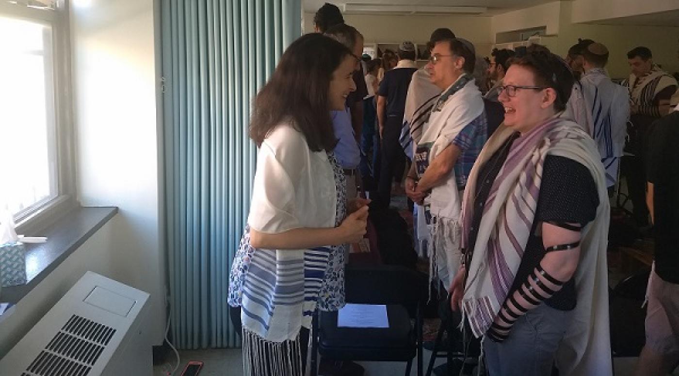 Sarah Hurwitz, left, a former speechwriter for first lady Michelle Obama, does a “gazing exercise” with RRC student Lily Solochek at Romemu Yeshiva, July 16, 2019.